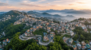 Scenic view of Aizawl city in Mizoram surrounded by lush green hills, colorful houses, churches, and misty mountains.