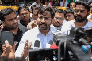 Abhijeet Dipke speaking to journalists during a media interaction.