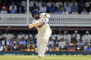 Young Virat Kohli batting for the Delhi domestic cricket team during a first-class cricket match.