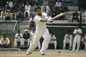 Young Virat Kohli practicing batting at the West Delhi Cricket Academy under the guidance of coach Rajkumar Sharma.