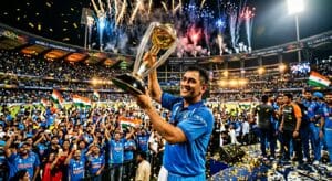 MS Dhoni in blue Indian jersey holding the ICC World Cup trophy aloft under fireworks and golden confetti at a packed stadium